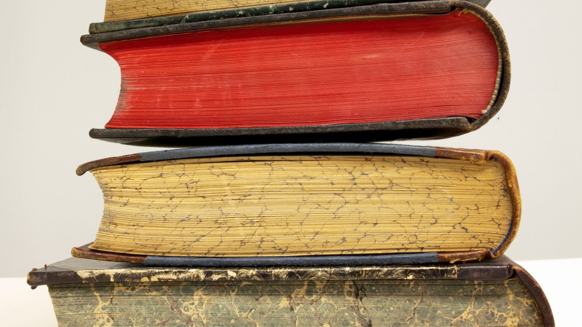 A small stack of antique closed books