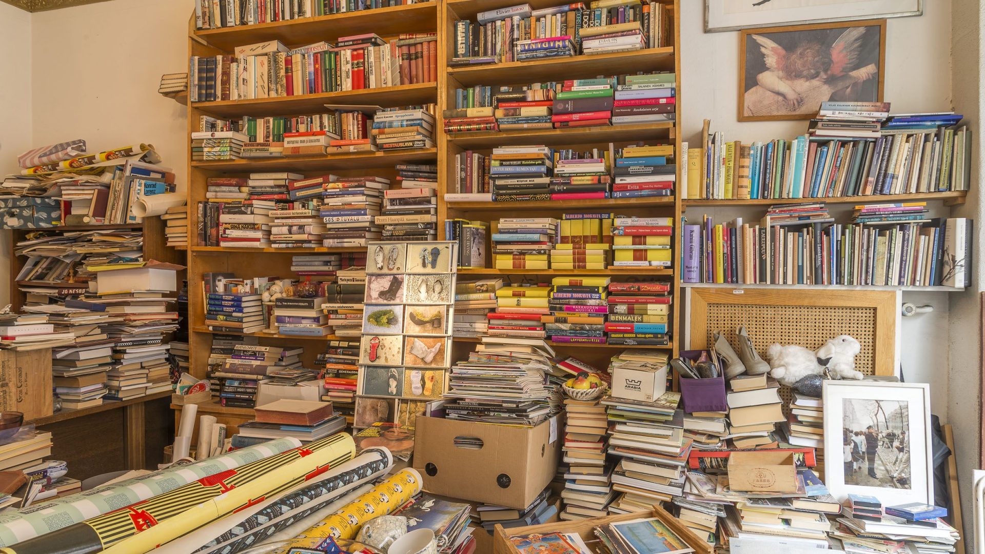 Interior of a secondhand bookshop, floor-to-ceiling shelves